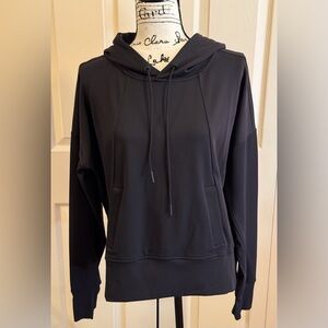 ATHLETA HOODED PULLOVER WITH  POCKETS AND THUMB HOLES. LONGER IN BACK.